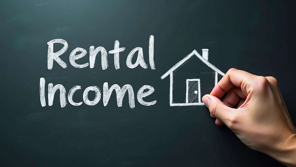 Chalkboard drawing of house with the words "Rental Income"